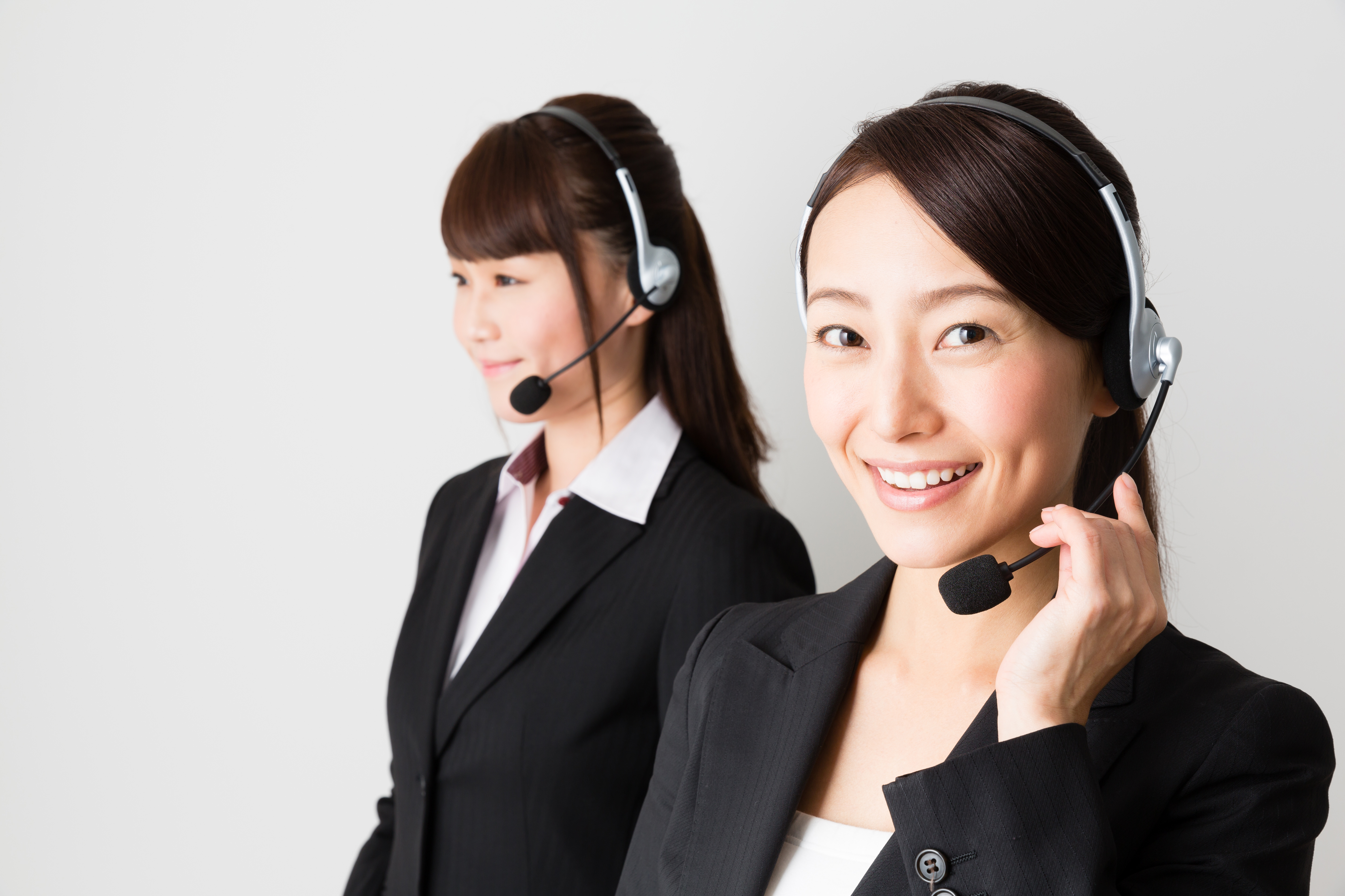 asian businesswomen using headset